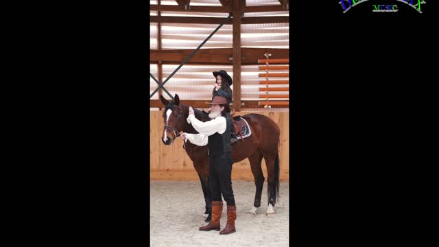 YOUND GIRL RIDING A HOURSE