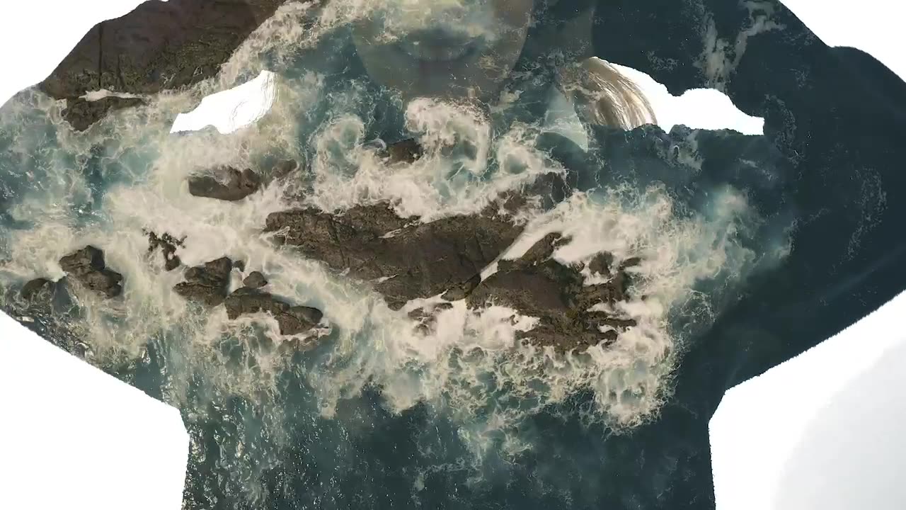 Woman and sea waves hitting a cliff