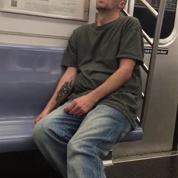 Man in grey shirt jeans falling asleep