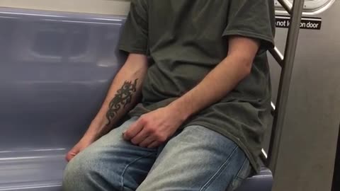 Man in grey shirt jeans falling asleep