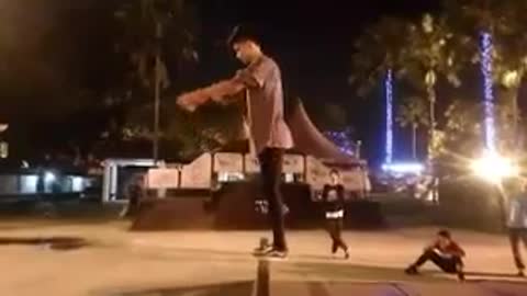 Guy dark sweater backflip fail