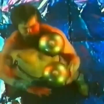 Soviet circus acrobat, Valentin Dikul, performing his power juggling act in 1985. The sphere balls weighed 88 lbs (40 kg) each.