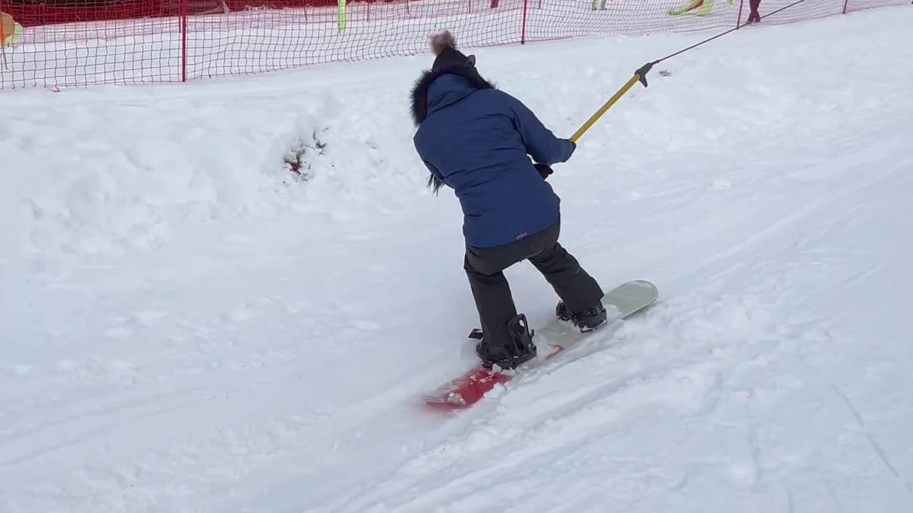 Learning Snowboarders Struggle on to Stay on Lift