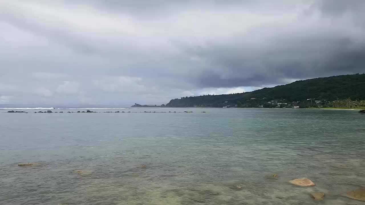 Dark clouds and the sea.