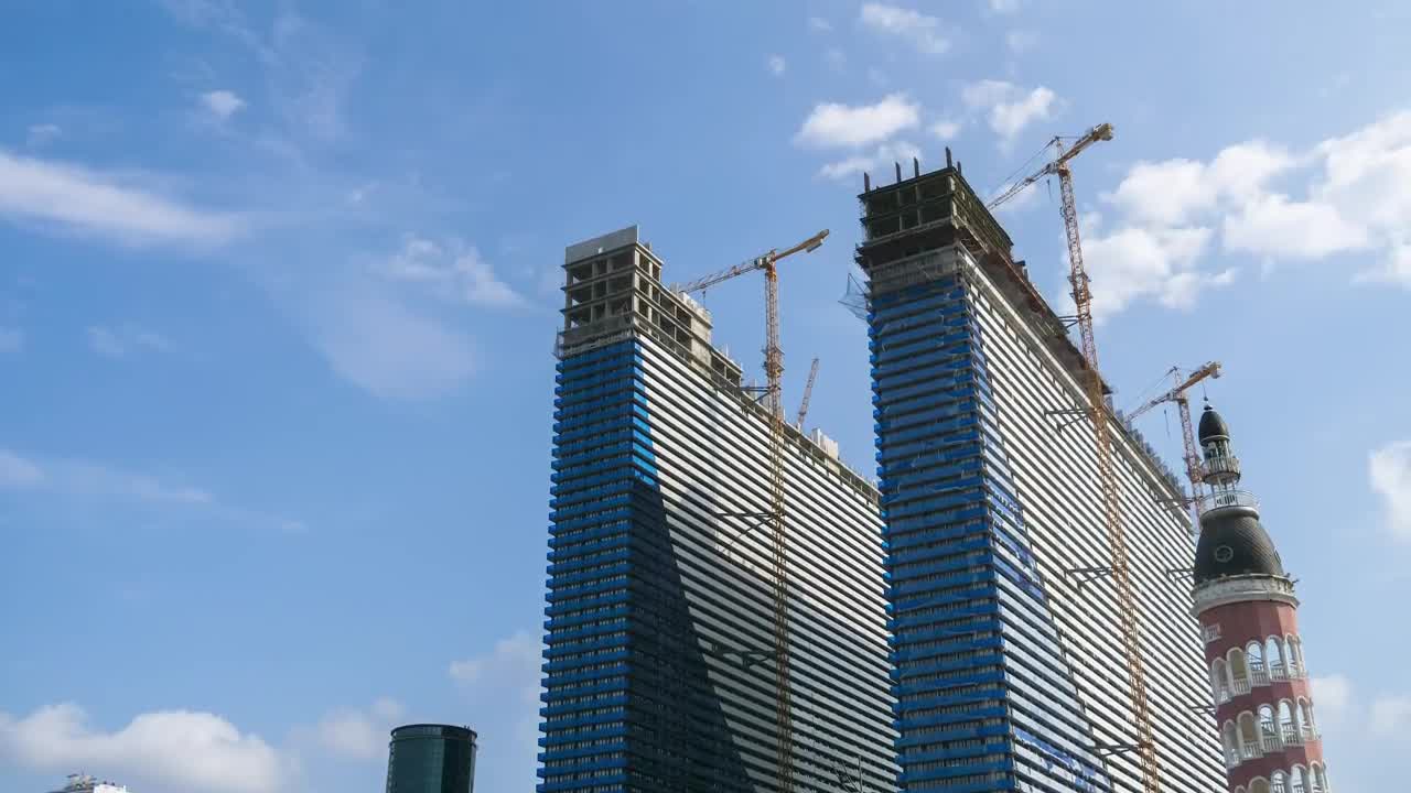 Skyscraper construction and cranes time lapse