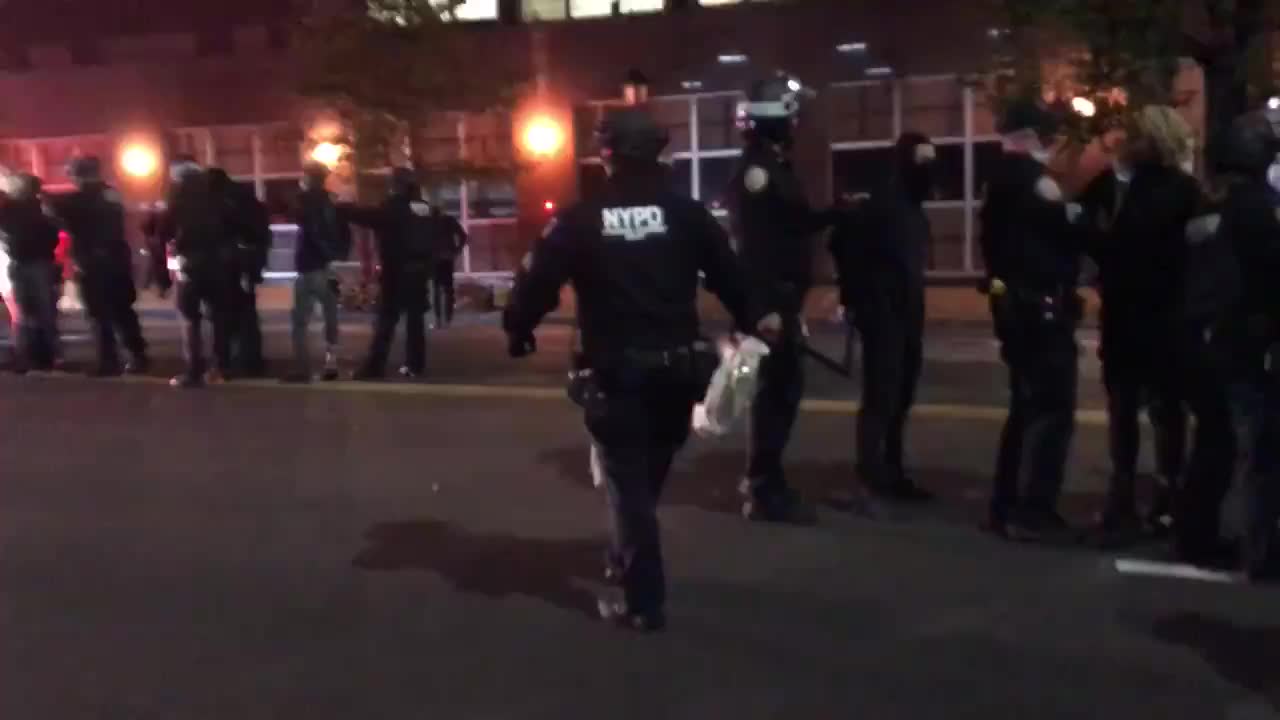 NYPD line up arrested rioters.