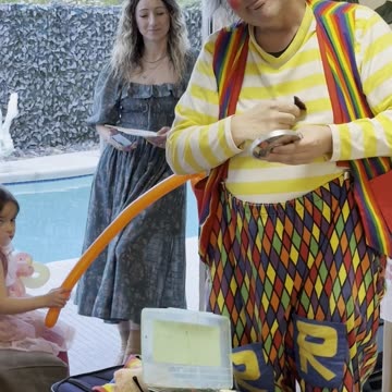 Applying clown makeup at a birthday party