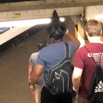A man wearing a grey rock helmet