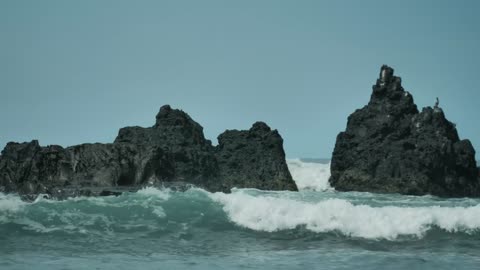 Sea waves and big rocks