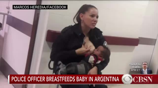 Police officer breastfeeding malnutrition baby.