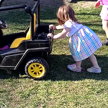 Skyla pushing car around