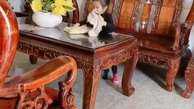 2 cute babies cleaning the house