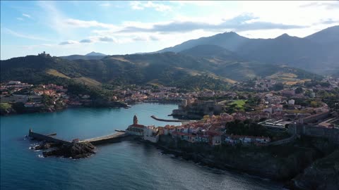 anse de la baleta collioure aerial view lighthouse castle residential houses on a rock mountai