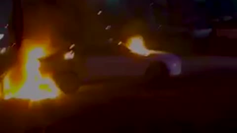 Car set on fire in the front of one of the mexican government buildings