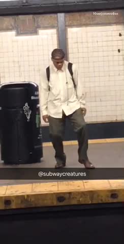 Guy green pants white dress shirt dancing subway station