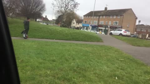 Elderly Man Cruising on Hoverboard