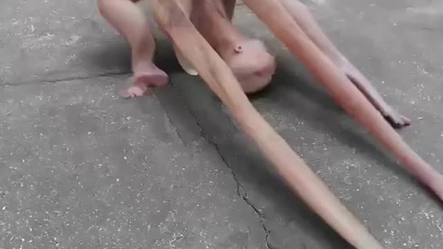 Rubber person walking on sidewalk