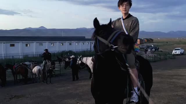 handsome man riding a horse