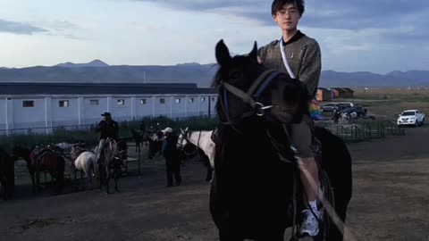 handsome man riding a horse