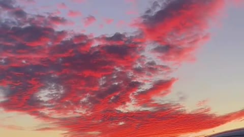 Shooting fiery red sky on the road