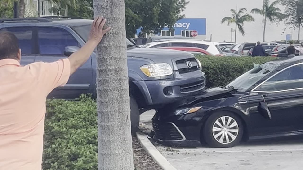 SUV Parked on Top of Car