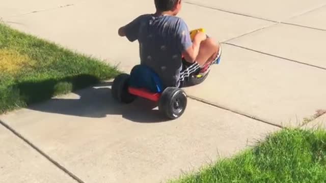 Adorable little child is playing with trolley and enjoying children's time