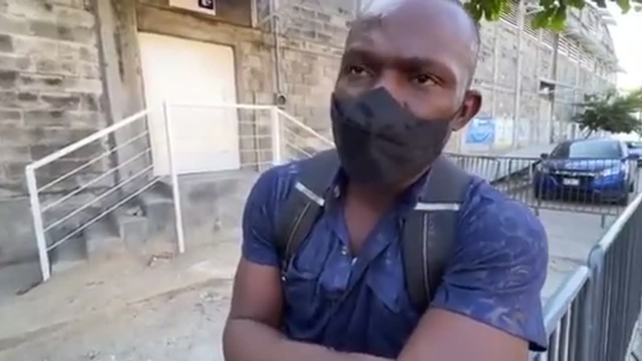 Haitian in Mexico is trying to get into America. He has a money card he says was issued by the UN