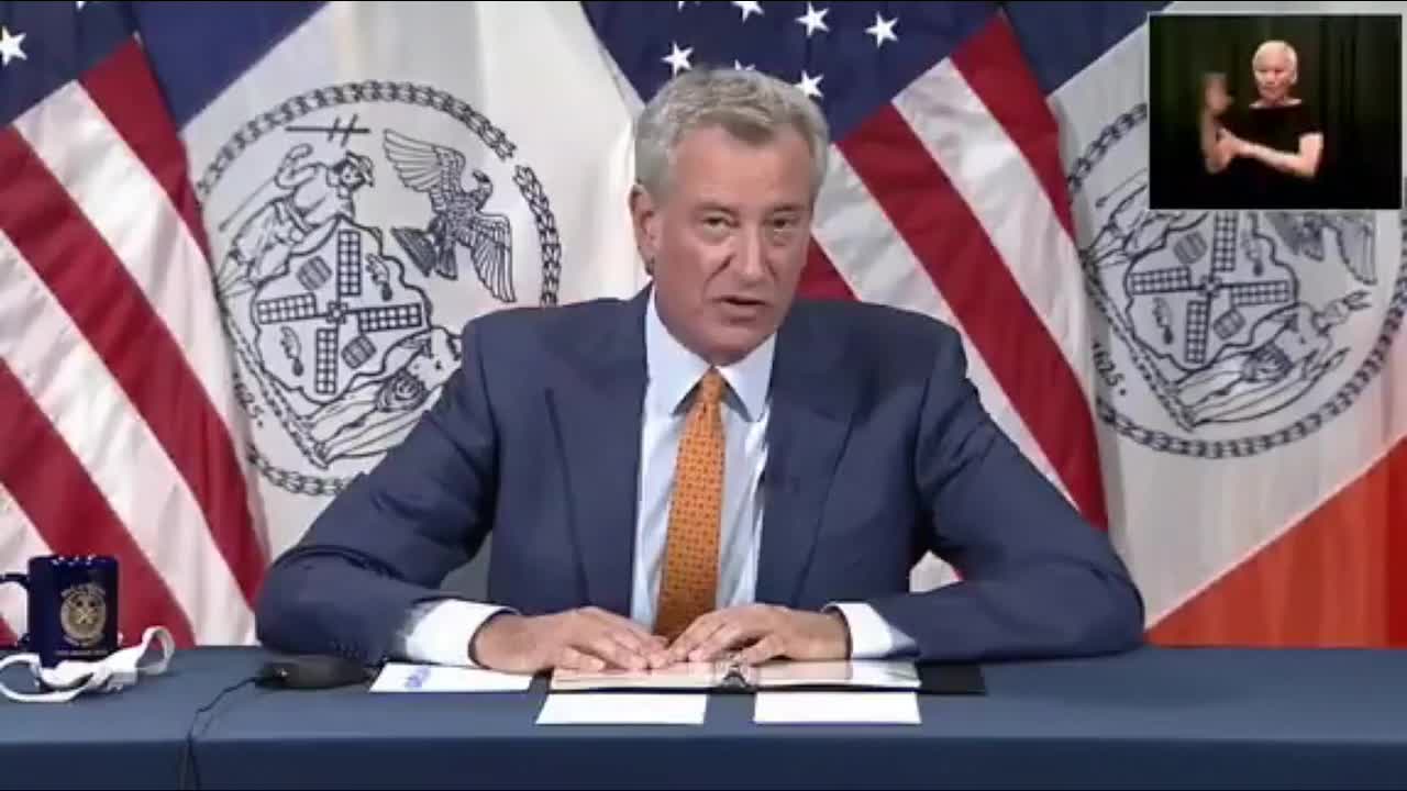 Mayor Bill de Blasio says: "We are going to flood New York Times Square with Police officers."