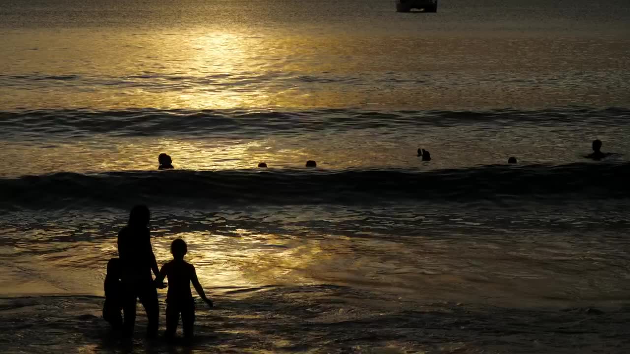 People silhouettes at the beach