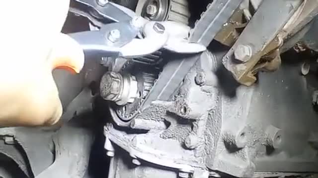 The mechanic cut off the belt