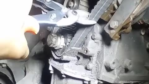 The mechanic cut off the belt