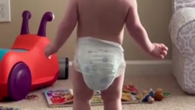 Dancing baby gets mad when mom stops the music