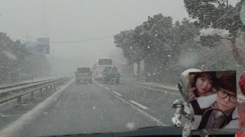 It's snowing a lot while driving