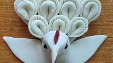 Creative chef making beautiful birds in dough.
