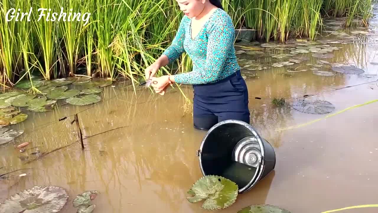 Beautiful girl catching fish