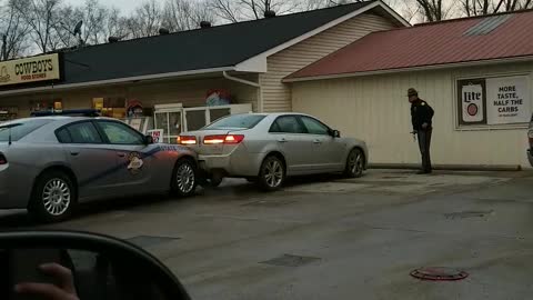 Driver Rams into Police Car at Gas Station