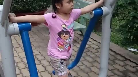 4-year-old cute baby exercise in the park