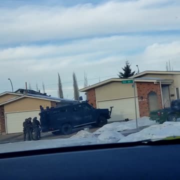 Tackle team going in a house