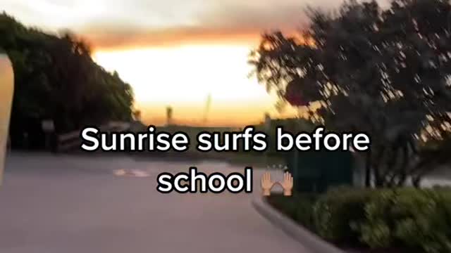 Sunrise surfs before school