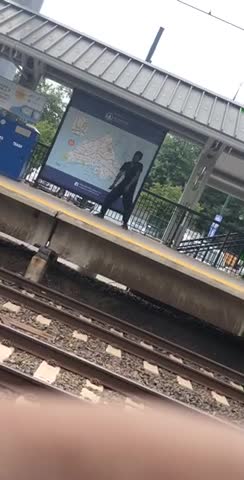 Guy in black outfit dancing on subway platform