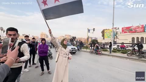 Syrian rebels topple statue of Assad's dad and drag its head through streets after lightning advance