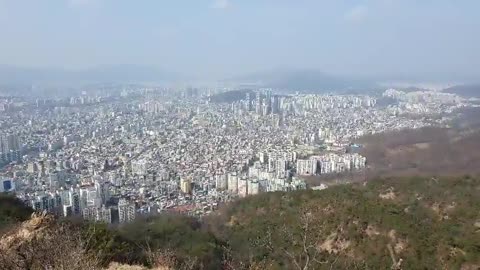 Seoul city covered with fine dust seen from the top of the mountain