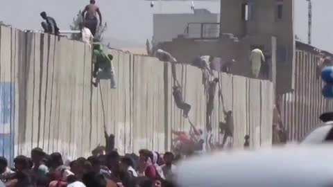 Shots of gunfire can be heard as crowds try to enter the facility.