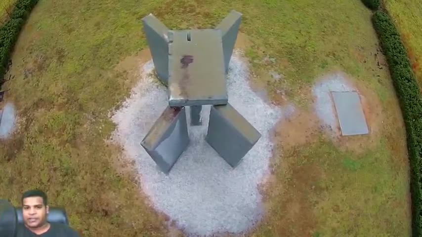 drone footage of blood stains on top of georgia guidestones from satanic rituals