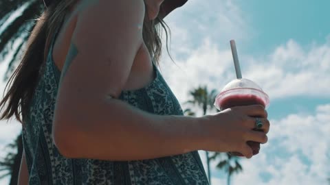 Woman holds cold drink