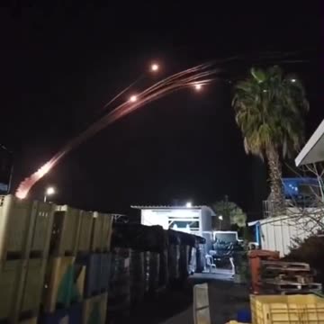 Hezbollah launches a massive rocket barrage from Lebanon against northern Israel.