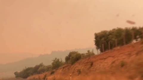 Smoke from Greece wildfire turns sky orange