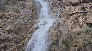 The video shows a stunning waterfall in Bani Minhsan, Azad Kashmir.