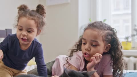 kids petting their cat