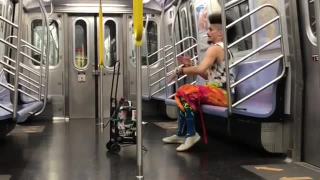 Man with orange pants with loud music on